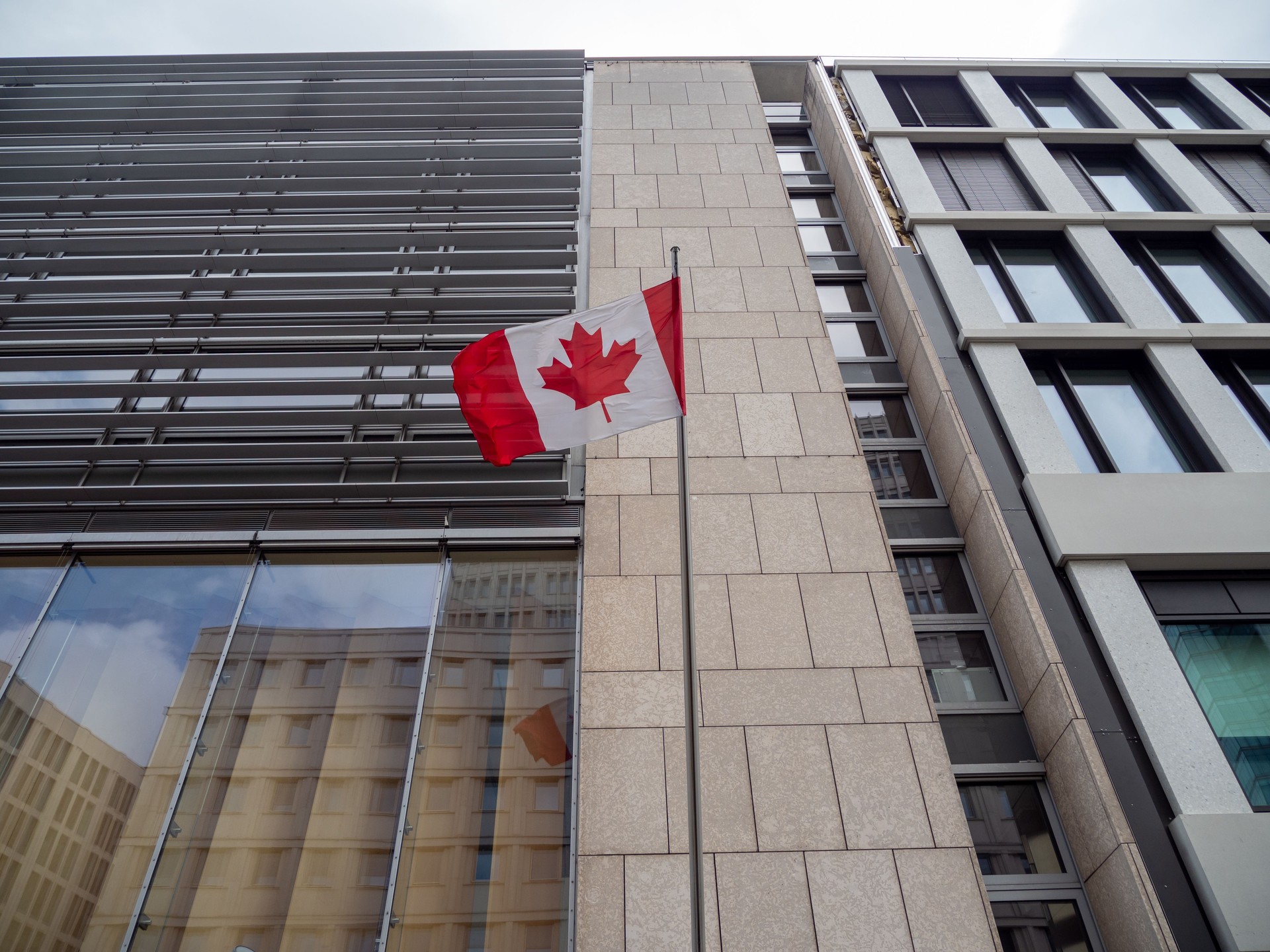Canada flag on the building. Flag of Canada.
