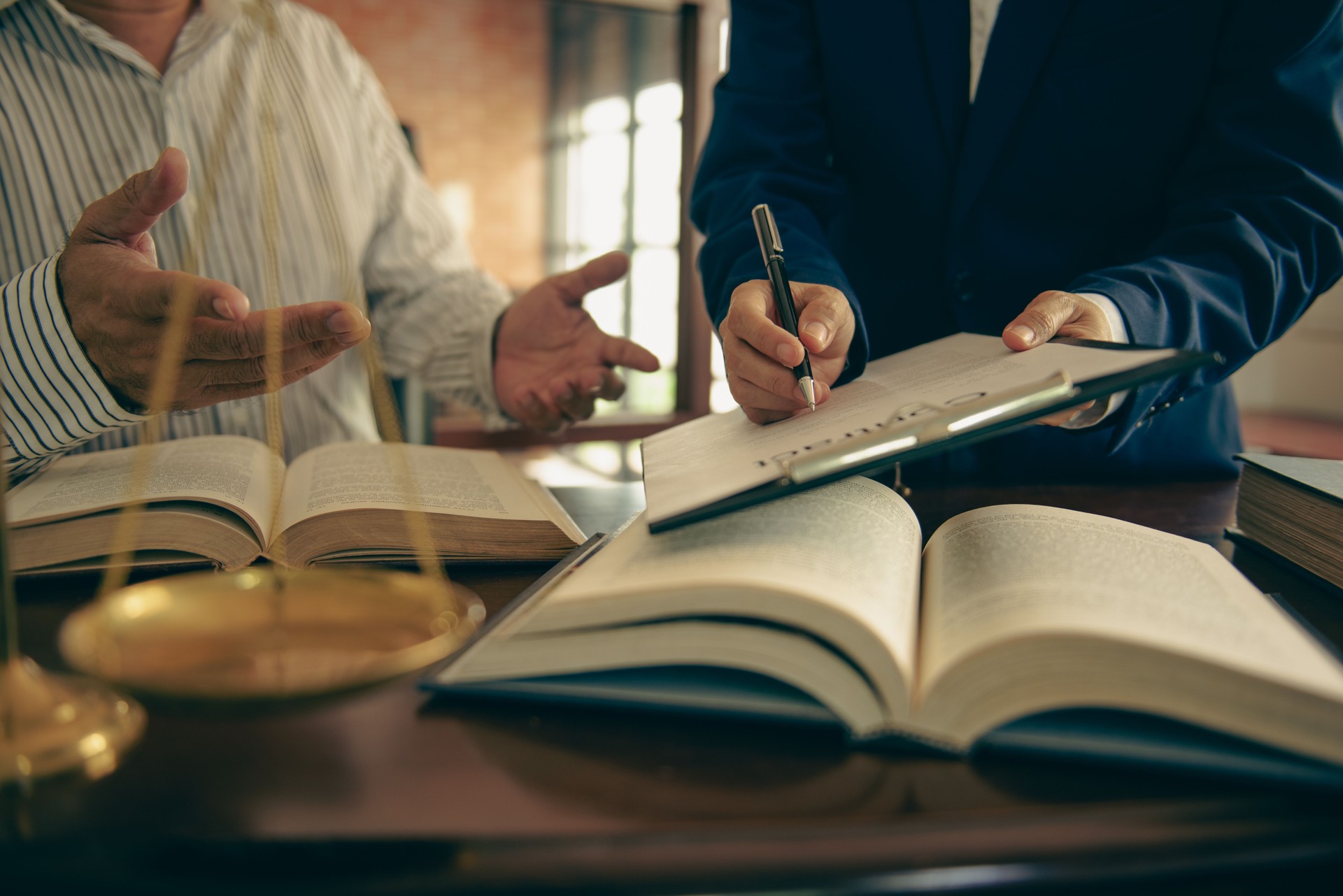 Business and lawyers discussing contract papers and juristic in office law legal services advice justice.